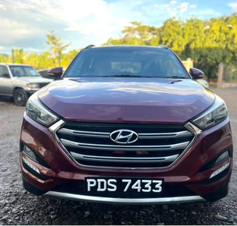 Burgundy Hyundai Tucson at Toiz Wit Noiz Auto Sales